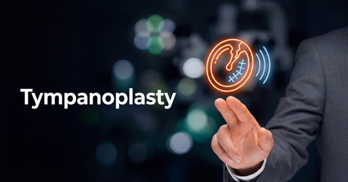 Tympanoplasty medical procedure concept shown by professional doctor interacting with futuristic glowing eardrum surgical icon graphic display