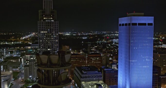 Omaha Nebraska Aerial v1 establishing shot of downtown cityscape, flying through city skyscrapers at night - Shot with Inspire 2, X7 camera - August 2020