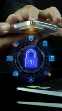 Businessman hands holding smartphone above laptop vertical shot with glowing padlock security hub. Mobile cyber data encryption protection, firewall network defense, and system safety idea concept.