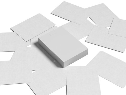 Blank white cards and box mockup scattered on studio surface