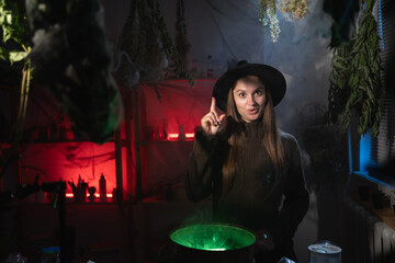 realistic witch brewing a potion in cauldron showing great idea gesture has good plan. Blend of everyday life with traditional witchcraft, magic and mystical atmosphere © Andrii Lysenko
