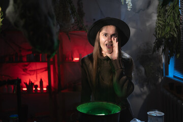 realistic witch brewing a potion in cauldron screaming good news making announce. Blend of everyday life with traditional witchcraft, magic and mystical atmosphere © Andrii Lysenko