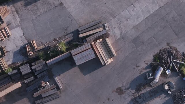 Aerial top-down view of lumber stacks at a woodworking factory