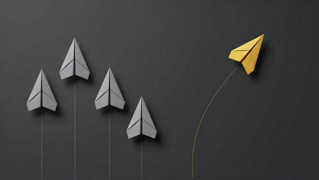 One yellow paper plane leading a group of grey paper planes with standing out business strategy follow the leader moving forward dark background leadership concept innovation different