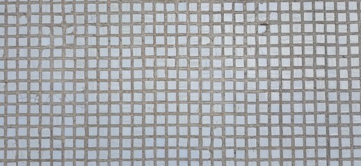 Fototapeta premium Small white ceramic facing tile. Texture, background.