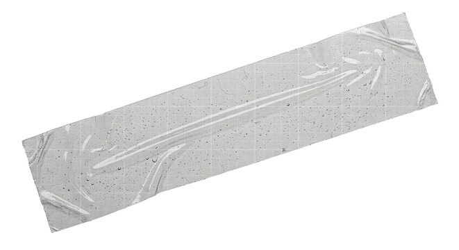 A piece of transparent adhesive tape stuck against a clean background, capturing the texture and slight wrinkles of the plastic material isolated on transparent background