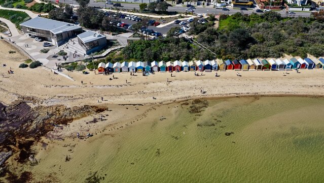 Brighton Beach, Melbourne, Victoria, Australia &ndash; 4K aerial drone view of iconic colourful bathing boxes, sandy beach, turquoise water, shoreline, luxury homes, residential suburb, Dendy Street Beach