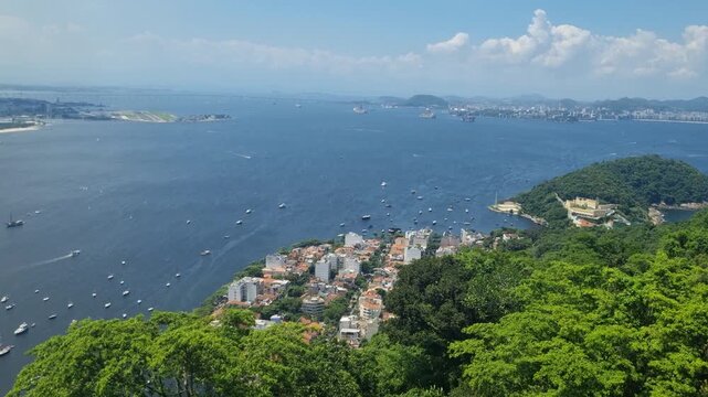 Breathtaking Rio de Janeiro panorama from Sugarloaf Mountain overlooking Guanabara Bay Urca boats, and Santos Dumont Airport