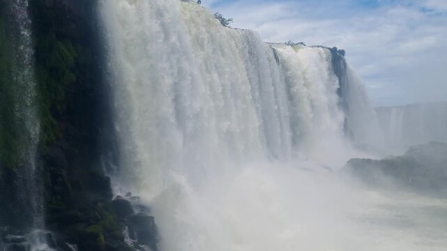 Close up of Iguaz&uacute; Falls from the Brazilian side, showing enormous volumes of water plunging over the rocky falls in a powerful cascade at this iconic natural landmark