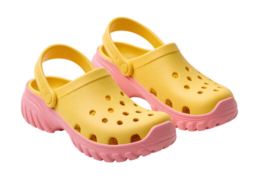 Yellow pink clog shoe isolated on white background with clipping path showing pair of perforated casual footwear