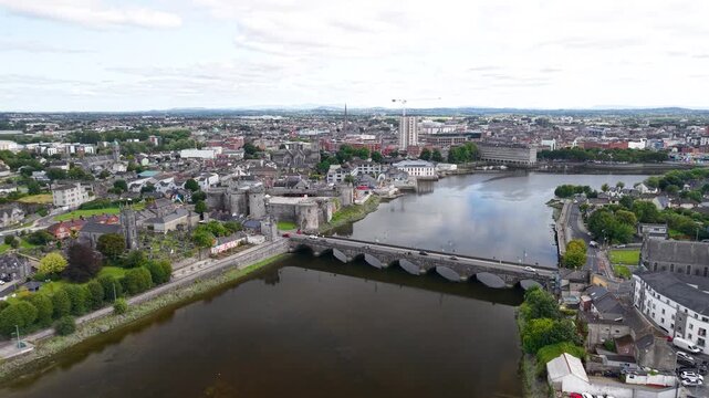 Aerial panorama of Limerick city and King's John's Castle building with old bridge. Ireland
