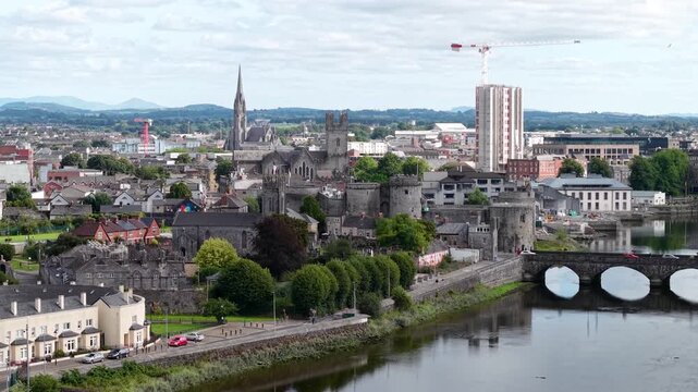 Limerick riverfront with castle, bridge and historical buildings. Drone cityscape, Ireland