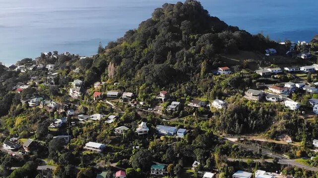 Mount Paku in Tairua drone reveal over Tairua town, Coromandel coastal settlement. New Zealand