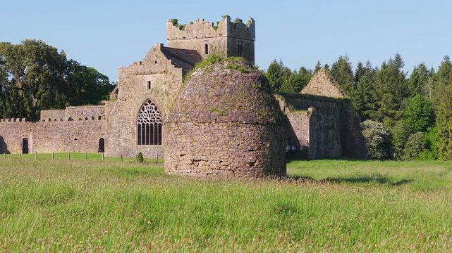 Drone View of Kilcooley Abbey Remains, Exterior Walls and Dovecote on Sunny Summer Day, Ireland, County Tipperary