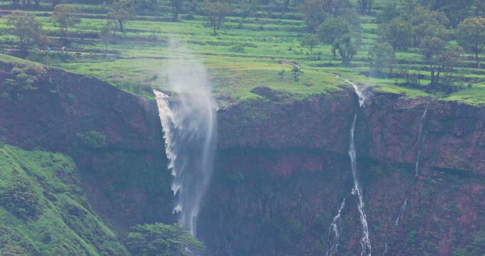 Rare: Powerful monsoon updraft drives cliff waterfall into reverse spray; slow motion Epic Sahyadri