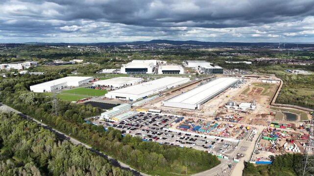 Aerial drone footage of a data center under construction beside completed facilities in Newport, South Wales, showing major technology infrastructure development.