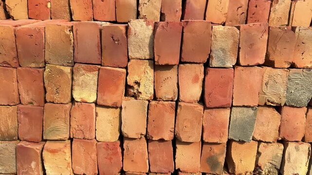 Stack of red bricks at construction site 4k video footage