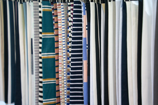 Various Patterned Fabrics Hung For Selection And Display