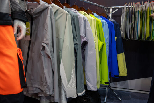 Various Color Outdoor Sport Jackets Hung on Clothing Racks
