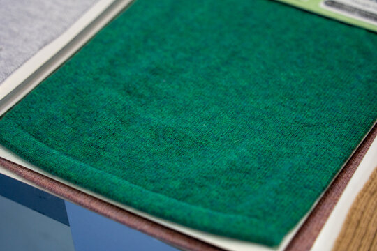 Close Up View of Green Felt Material Layered with Other Sheets