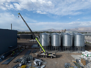 large silver silo construction hoisting site © zhu difeng