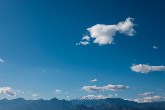 Mountain landscape beneath dramatic clouds in the sky