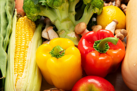 Different fresh vegetables as background.