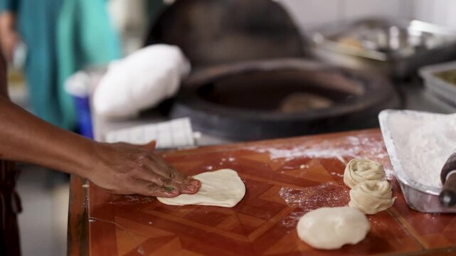 Chef Hands Kneading and Shaping Dough for Naan Flatbread
