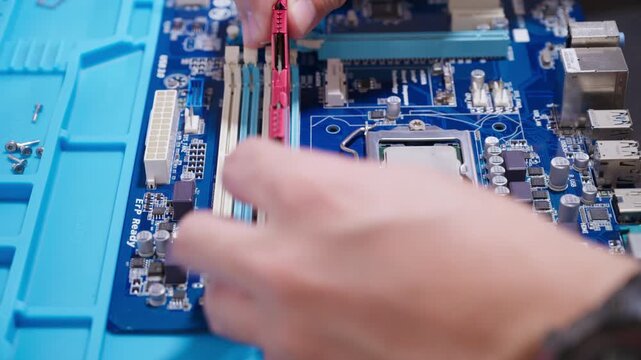 installing a computer RAM memory module card into a motherboard connector slot as a conceptual backdrop for computer building hardware upgrade memory performance technology innovation