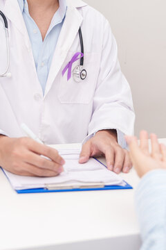 Doctor and patient having a medical consultation for purple ribbon for concept of Violence, Pancreatic, Esophageal, Testicular cancer, Alzheimer, Epilepsy, Lupus and Fibromyalgia. Awareness month