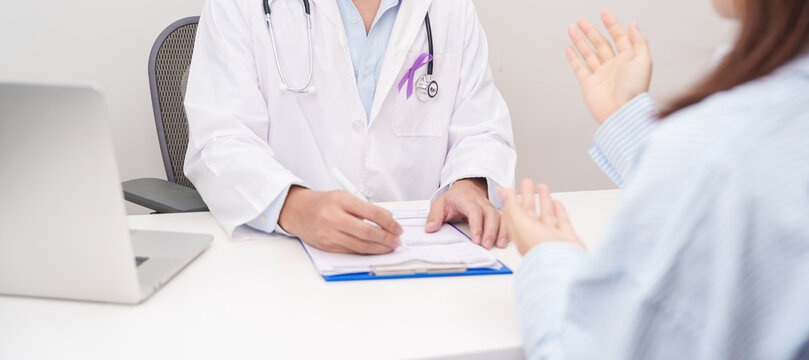 Doctor and patient having a medical consultation for purple ribbon for concept of Violence, Pancreatic, Esophageal, Testicular cancer, Alzheimer, Epilepsy, Lupus and Fibromyalgia. Awareness month