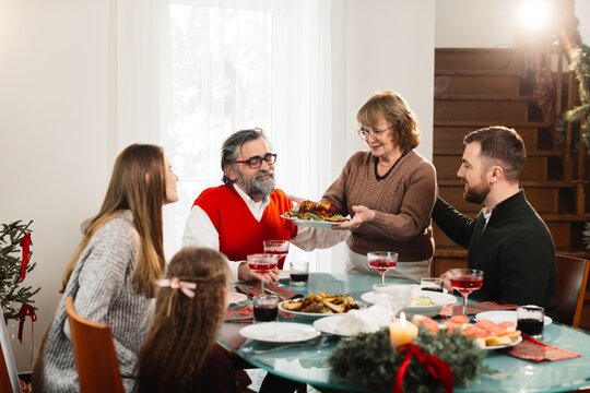 Family enjoying christmas dinner together at home