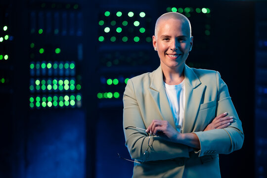 Woman smiling in server room managing data technology