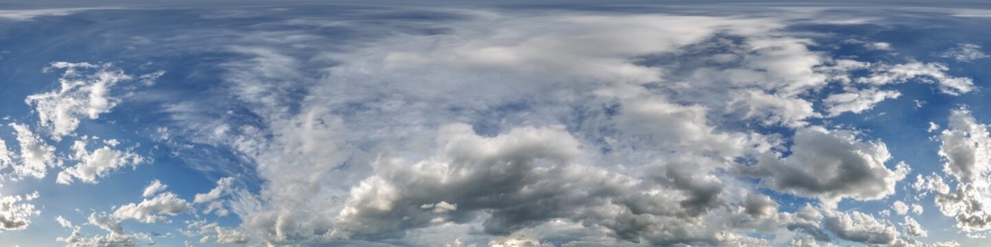 360 hdri blue sky with beautiful clouds with halo like a seamless panorama view with zenith for use in 3d graphics or game development as sky dome or edit drone shot