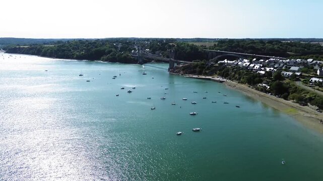 Aerial view of Pont Saint-Hubert and sailboats on the Rance estuary near Saint-Jean, Brittany, France.