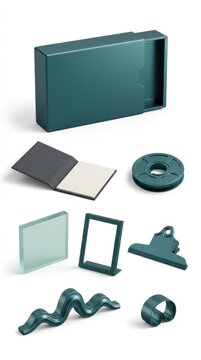 Assorted green desktop stationery items on white surface, including box, notebook, and clipboard