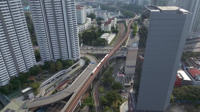 MRT Trains And Traffic Pass Through KL Sentral Area Kuala Lumpur City Malaysia Drone Static 4K 60FPS