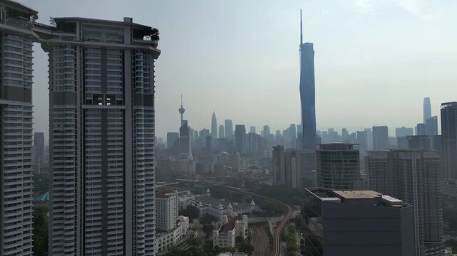 Merdeka 118 Stands Tall Amongst Urban Kuala Lumpur Malaysia Pollution Haze Drone Static Shot 4K 60FPS
