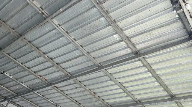 Diagonal perspective view of mild steel roof framework with galvalume sheets