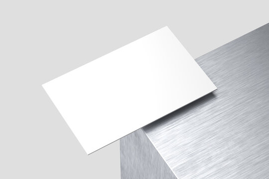 white business card on metal with a gray background, 3D render