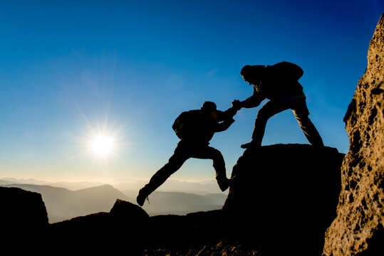 A Helping Hand Toward Success, Climbers on a Rocky Mountain