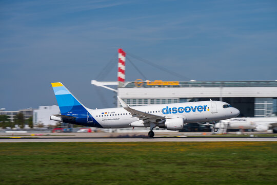 Discover Airlines Airbus A320-200, registration D-AIUW, touching down on Runway 08R at Munich Airport (MUC/EDDM)