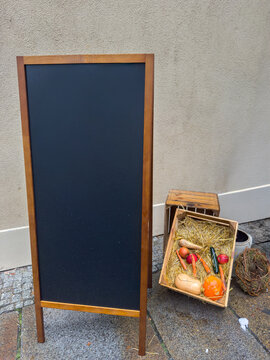 Vegetables in Wooden Crate with Blank Board at Autumn Market