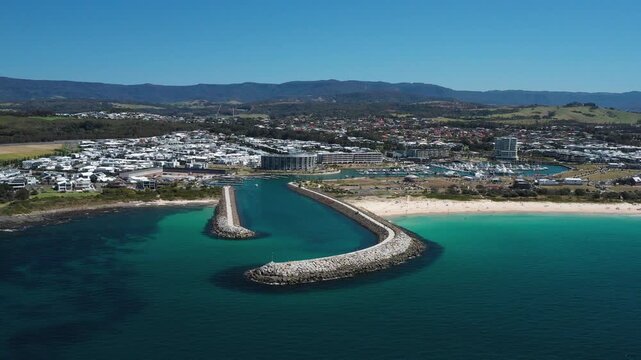 Shell Cove breakwater and turquoise blue ocean entrance leading to the scenic Shellharbour Marina and beautiful beaches, situated on the Illawarra South Coast of New South Wales, Australia.