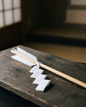 Hamaya good luck arrow with white shide paper New Year shrine visit, close-up with copy space at top
