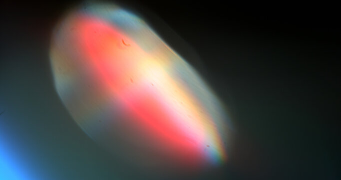 Vivid color spectrum light leak with smooth gradient transitions and optical glow. Abstract cinematic background suitable for overlays, visual effects and creative projects.