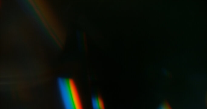 Abstract cinematic lens flare with soft bokeh circles and subtle light reflections. Atmospheric optical effect background ideal for overlays, visual effects, film production and creative design.