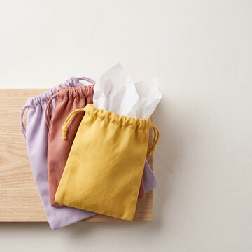 Pastel cotton drawstring lucky bags fukubukuro New Year sale product image, flat lay with copy space at top