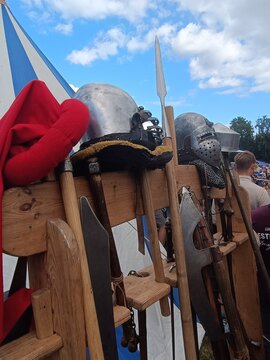 Medieval Armor and Weapons Display at Outdoor Historical Reenactment Event