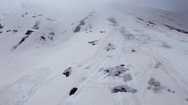 Aerial view of Campocatino ski resort in winter fog, Italy